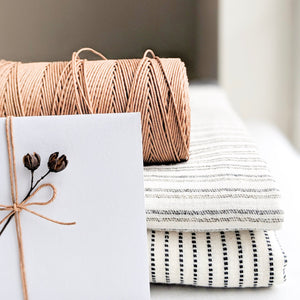 Handwoven Textile by Ginger Sparrow, a modern home decor brand. Featuring black ticking stripes on a soft ivory ground. Light and airy its perfect for #throwpillows #drapes #livingroomdecor #bedroomideas