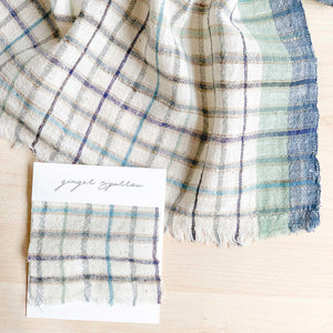 Handwoven Textile by Ginger Sparrow, a modern home decor brand. Featuring a soft ivory ground with a green and indigo striped weave. Light and airy its perfect for #windowshades #drapes #livingroomdecor #bedroomideas
