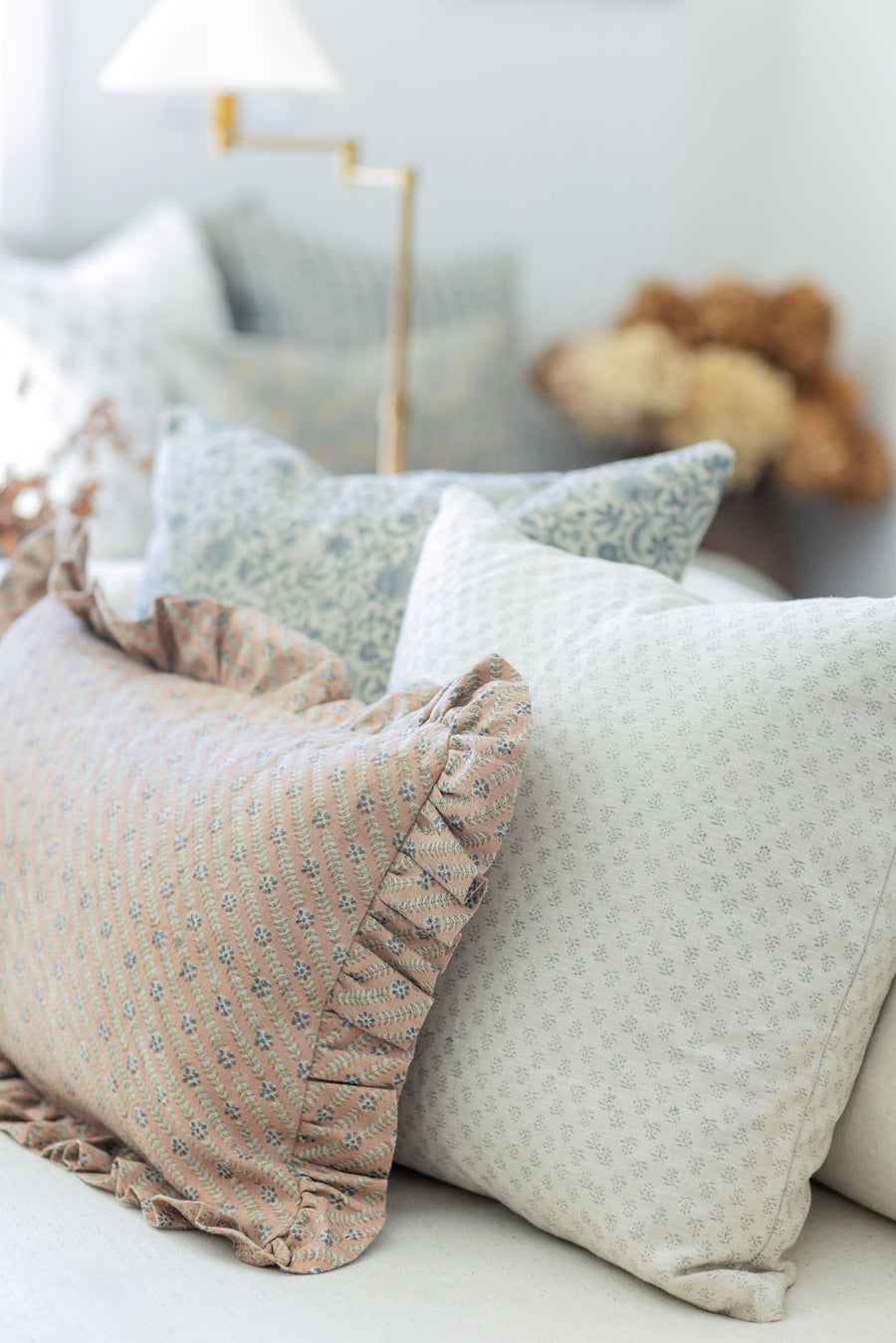 Decorative pillows on a sofa with a blurred background