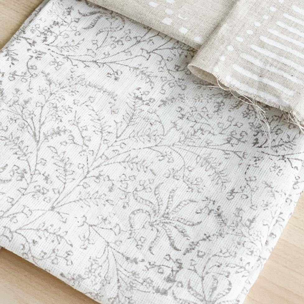 Hand block printed Textile by Ginger Sparrow, a modern home decor brand. Featuring a delicate floral pattern in three color options - olive grey, tan and pale blue. Light and airy its perfect for #throwpillows #drapes #livingroomdecor #bedroomideas #upholsteryfabric #fabricbytheyard