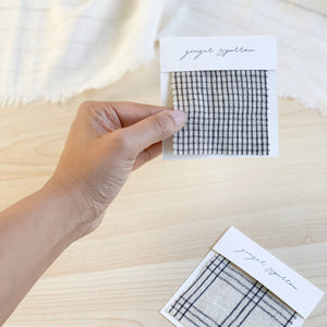 Handwoven Textile by Ginger Sparrow, a modern home decor brand. Featuring a charcoal black stripe pattern woven on a soft ivory ground. Light and airy its perfect for #throwpillows #drapes #livingroomdecor #bedroomideas