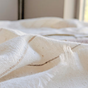 Handwoven Textile by Ginger Sparrow, a modern home decor brand. Featuring a soft ivory ground with fawn colored striped weave. Light and airy its perfect for #windowshades #drapes #livingroomdecor #bedroomideas