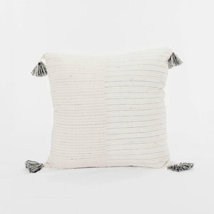 A soft ivory pillow in 22x22 inch size featuring fawn and indigo striped weave and lush corner tassels.