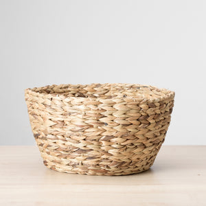 A water grass baskets by Ginger Sparrow, a modern home decor brand. Great as a gathering basket for a shelf to gather clutter, or contain fruits, logs, pillows, blankets.  