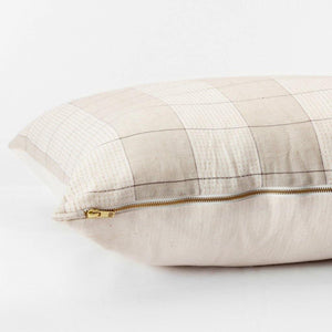Throw pillow by Ginger Sparrow, a modern handcrafted home decor brand. The pillow features a soft ivory and dusty sage base with air geometric lines in a grid pattern. 