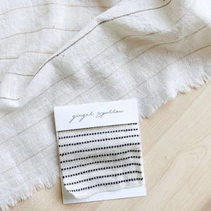 Handwoven Textile by Ginger Sparrow, a modern home decor brand. Featuring black ticking stripes on a soft ivory ground. Light and airy its perfect for #throwpillows #drapes #livingroomdecor #bedroomideas