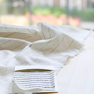 Handwoven Textile by Ginger Sparrow, a modern home decor brand. Featuring black ticking stripes on a soft ivory ground. Light and airy its perfect for #throwpillows #drapes #livingroomdecor #bedroomideas