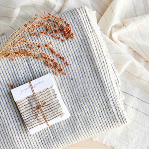 Handwoven Textile by Ginger Sparrow, a modern home decor brand. Featuring a deep indigo rugged striped weave on a soft ivory base. Light and airy its perfect for #throwpillows #drapes #livingroomdecor #bedroomideas