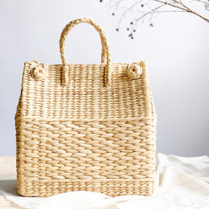 Watergrass Hamper Baskets in a light buttery golden hue. Handcrafted in 3 nesting sizes, great as a picnic hamper baskets. Crafted by Ginger Sparrow, a modern home decor brand. 