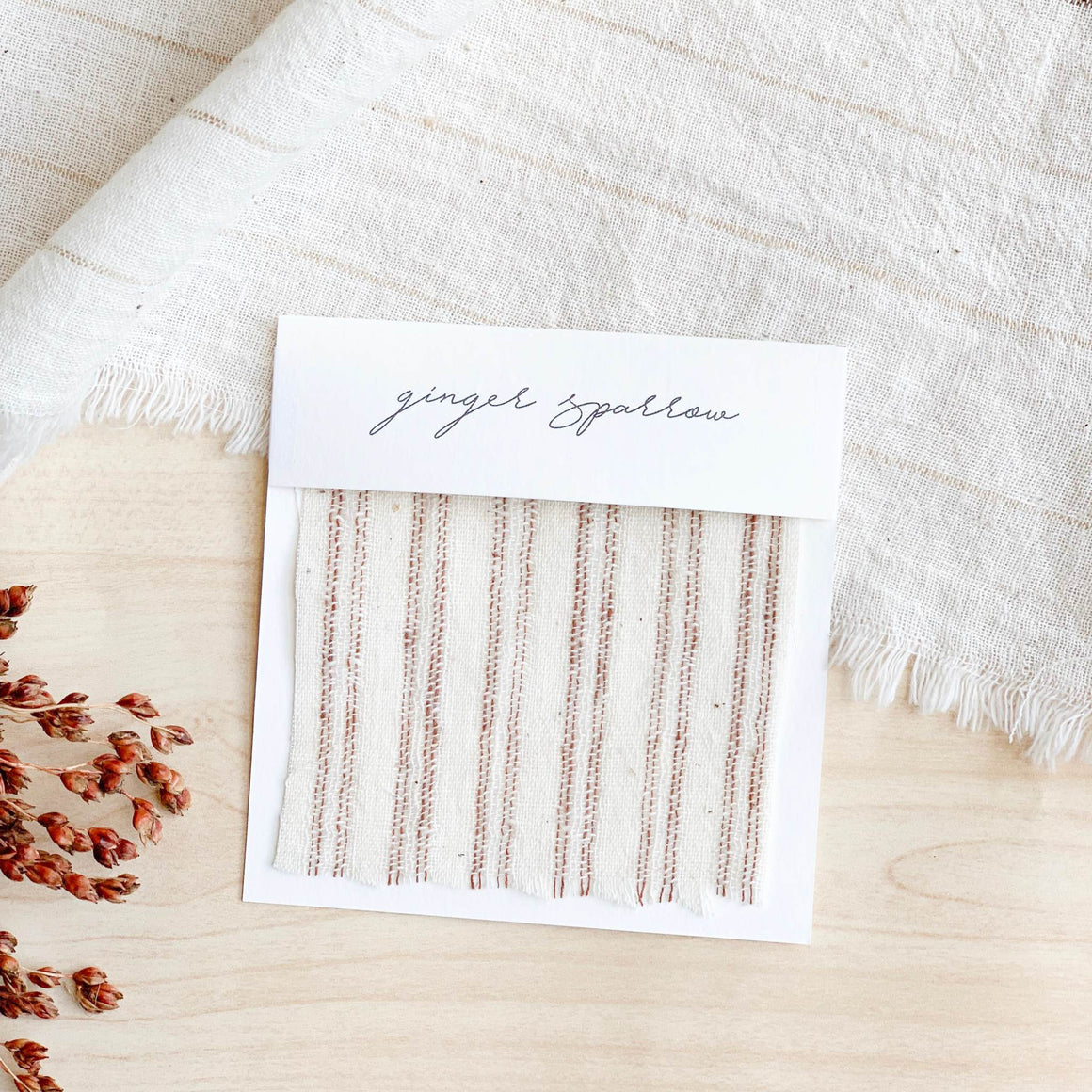 Handwoven cotton textile by Ginger Sparrow, a modern home decor brand. Featuring rugged stripes in earthy terracotta on a soft ivory ground. Light and airy its perfect for #throwpillows #drapes #livingroomdecor #bedroomideas