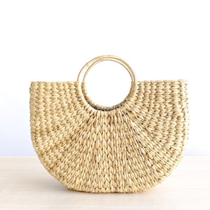A water grass baskets featuring a striking arc silhouette. Shelf basket. Market basket, beach basket, basket bag. Spring vibe. Buttery Golden Hue. 