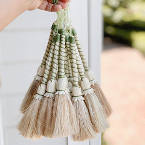 Handwoven palm leaf brush for light cleaning and dust cleaning around the house, great also as a shelf accent. 