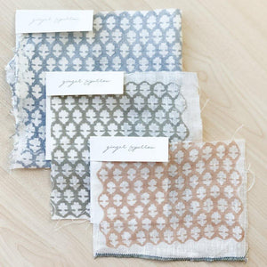 Hand block printed Textile by Ginger Sparrow, a modern home decor brand. Featuring a delicate floral pattern in three color options - olive grey, tan and pale blue. Light and airy its perfect for #throwpillows #drapes #livingroomdecor #bedroomideas #upholsteryfabric #fabricbytheyard