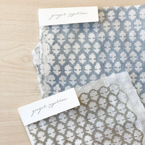 Hand block printed Textile by Ginger Sparrow, a modern home decor brand. Featuring a delicate floral pattern in three color options - olive grey, tan and pale blue. Light and airy its perfect for #throwpillows #drapes #livingroomdecor #bedroomideas #upholsteryfabric #fabricbytheyard