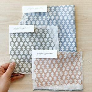 Hand block printed Textile by Ginger Sparrow, a modern home decor brand. Featuring a delicate floral pattern in three color options - olive grey, tan and pale blue. Light and airy its perfect for #throwpillows #drapes #livingroomdecor #bedroomideas #upholsteryfabric #fabricbytheyard 