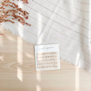 Handwoven Textile by Ginger Sparrow, a modern home decor brand. Featuring a brown ticking stripe woven on a soft ivory ground. Light and airy its perfect for #throwpillows #drapes #livingroomdecor #bedroomideas