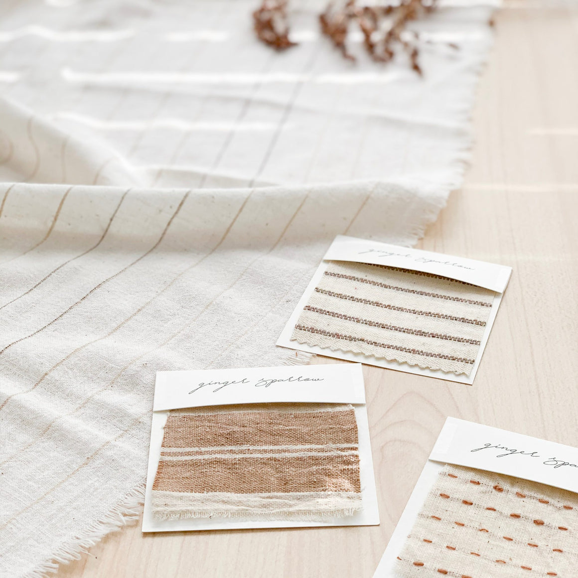Handwoven Textile by Ginger Sparrow, a modern home decor brand. Featuring a brown ticking stripe woven on a soft ivory ground. Light and airy its perfect for #throwpillows #drapes #livingroomdecor #bedroomideas