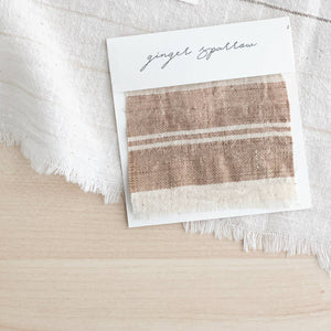 Handwoven Textile by Ginger Sparrow, a modern home decor brand. Featuring a brown thick stripe woven on a soft ivory ground. Light and airy its perfect for #throwpillows #drapes #livingroomdecor #bedroomideas