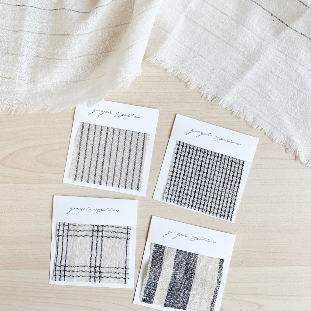 Handwoven Textile by Ginger Sparrow, a modern home decor brand. Featuring a charcoal black stripe pattern woven on a soft ivory ground. Light and airy its perfect for #throwpillows #drapes #livingroomdecor #bedroomideas