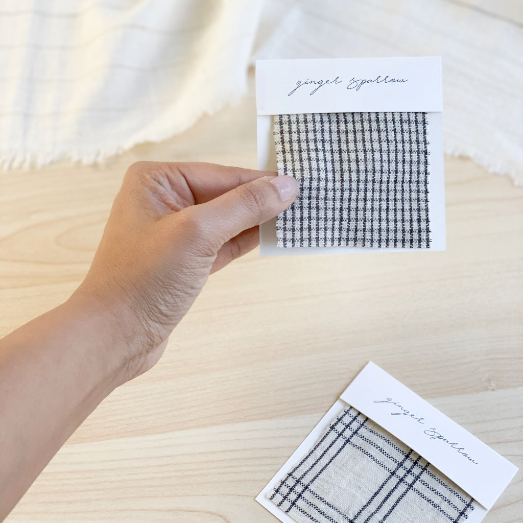 Handwoven Textile by Ginger Sparrow, a modern home decor brand. Featuring a charcoal black stripe pattern woven on a soft ivory ground. Light and airy its perfect for #throwpillows #drapes #livingroomdecor #bedroomideas