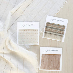 Handwoven Textile by Ginger Sparrow, a modern home decor brand. Featuring a brown thick stripe woven on a soft ivory ground. Light and airy its perfect for #throwpillows #drapes #livingroomdecor #bedroomideas