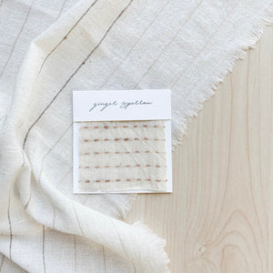 Handwoven Textile by Ginger Sparrow, a modern home decor brand. Featuring a brown ticking stripe woven on a soft ivory ground. Light and airy its perfect for #throwpillows #drapes #livingroomdecor #bedroomideas