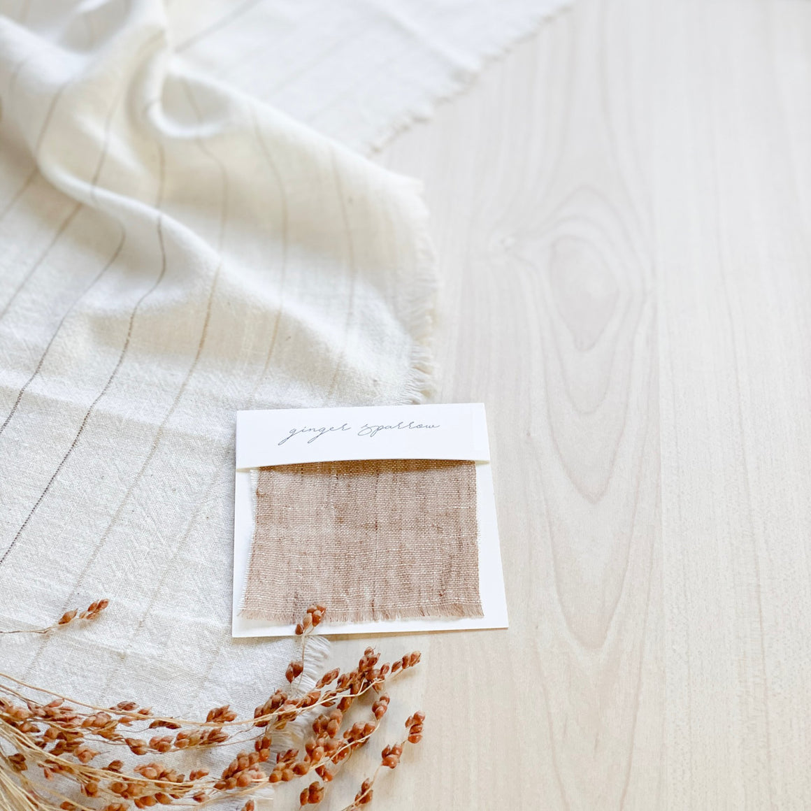 Handwoven Textile by Ginger Sparrow, a modern home decor brand. Featuring a brown thick stripe woven on a soft ivory ground. Light and airy its perfect for #throwpillows #drapes #livingroomdecor #bedroomideas