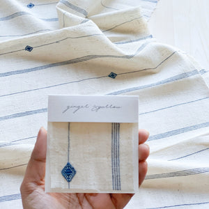 Handwoven Textile by Ginger Sparrow, a modern home decor brand. Featuring a blue diamond pattern woven, light and airy its perfect for #throwpillows #drapes #livingroomdecor #bedroomideas