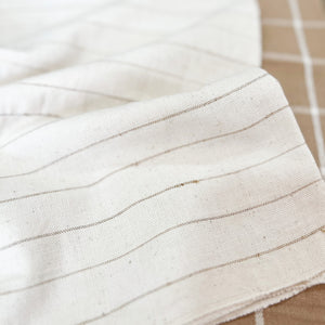 Handwoven Textile by Ginger Sparrow, a modern home decor brand. Featuring a soft ivory ground with fawn colored striped weave. Light and airy its perfect for #windowshades #drapes #livingroomdecor #bedroomideas