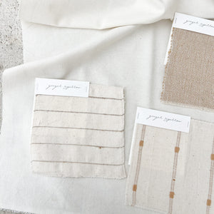 Handwoven Textile by Ginger Sparrow, a modern home decor brand. Featuring a soft ivory ground with fawn colored striped weave. Light and airy its perfect for #windowshades #drapes #livingroomdecor #bedroomideas