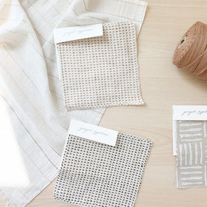 Handwoven Textile by Ginger Sparrow, a modern home decor brand. Featuring a charcoal black stripe pattern woven on a soft ivory ground. Light and airy its perfect for #throwpillows #drapes #livingroomdecor #bedroomideas