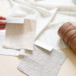 Handwoven Textile by Ginger Sparrow, a modern home decor brand. Featuring a charcoal black stripe pattern woven on a soft ivory ground. Light and airy its perfect for #throwpillows #drapes #livingroomdecor #bedroomideas
