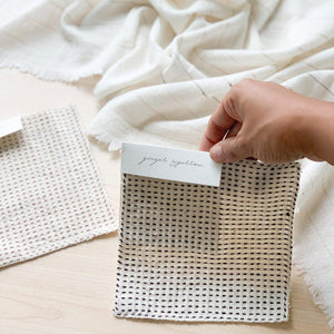 Handwoven Textile by Ginger Sparrow, a modern home decor brand. Featuring a charcoal black stripe pattern woven on a soft ivory ground. Light and airy its perfect for #throwpillows #drapes #livingroomdecor #bedroomideas