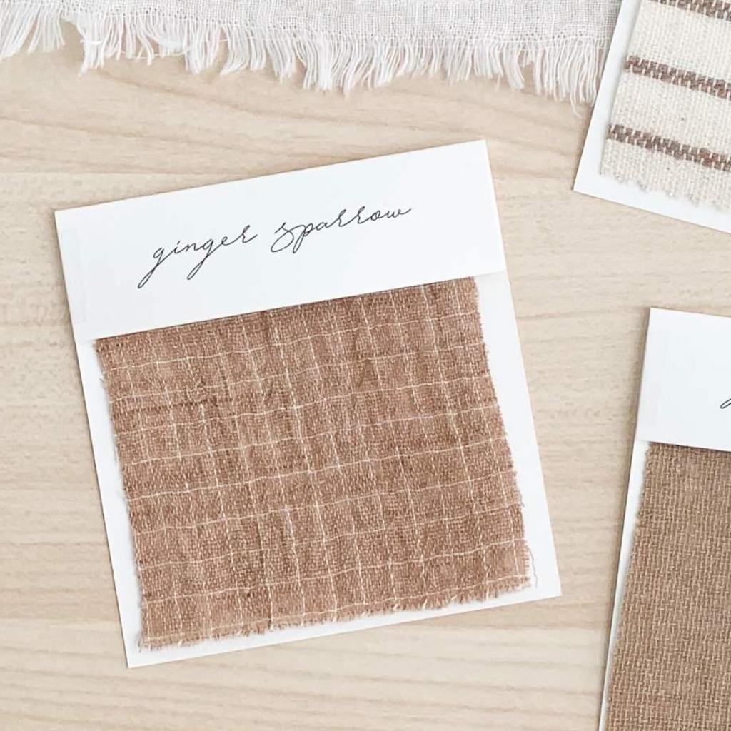 Handwoven Textile by Ginger Sparrow, a modern home decor brand. Featuring a brown fabric with white checked pattern. Light and airy its perfect for #throwpillows #drapes #livingroomdecor #bedroomideas